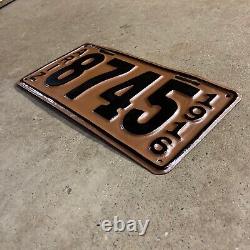 1916 Arizona license plate 8745 black on copper embossed