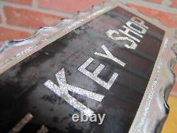THE KEY SHOP Antique Reverse on Chip Scalloped Glass Advertising Sign ROG