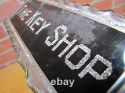 THE KEY SHOP Antique Reverse on Chip Scalloped Glass Advertising Sign ROG